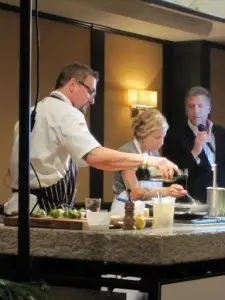 Chris Cosentino & Jamie Lauren's friendly cook-off competition - MC Michael Chiarello looks on