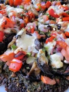 Safeehat Falafel "Pizza" with garbanzo crust, pesto, eggplant, red bell pepper, onions, shitake mushrooms, tomato, feta, goat cheese ($6)