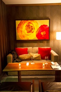 Couches & bright colors warm up the bar area