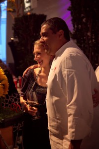 Chef Michael Mina poses for photos as he serves food