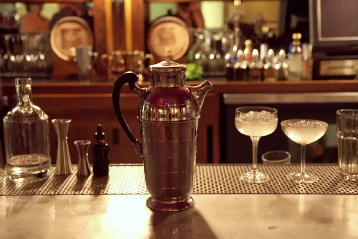 Cocktails for the group shaken tableside in vintage shakers