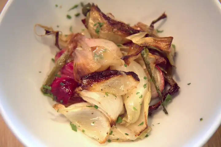 Flavor-rich side of grilled onions at Elmira Rosticerria