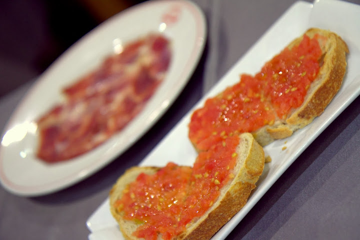 Simple Spanish perfection: tomato sauce on toast with jamon Iberico
