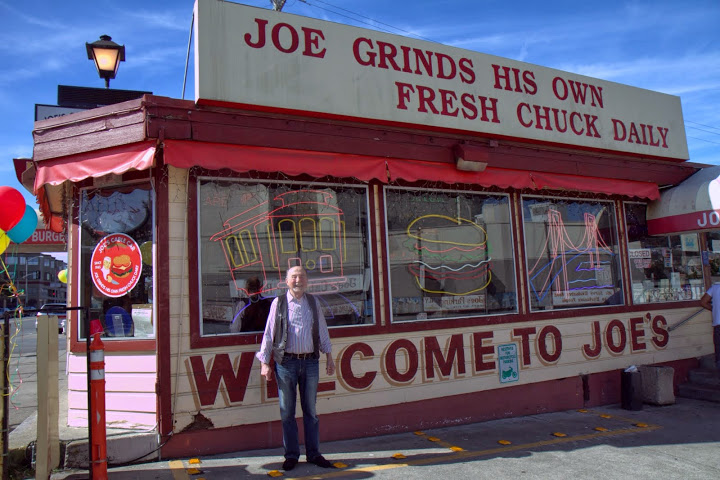 Joe Obegi in front of his iconic burger joint on its last day