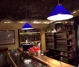 Sitting at the bar looking at vinyl collection