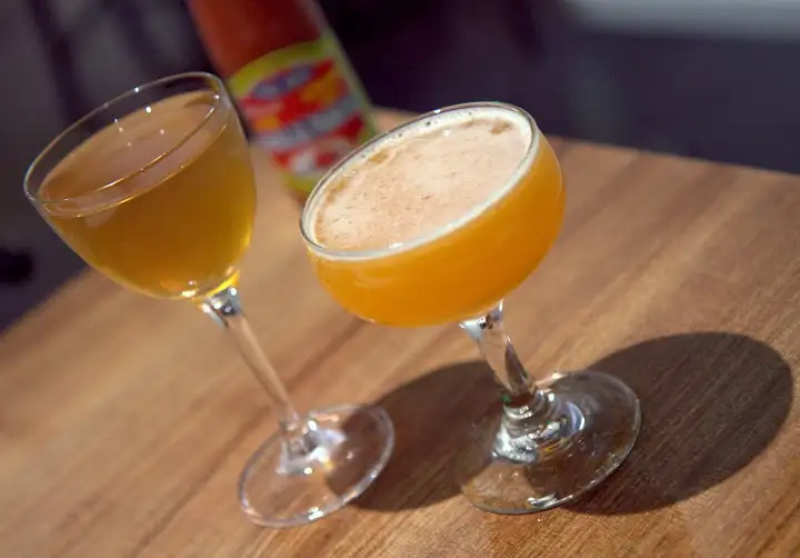 Sao Thai (Thai Girl) on right: Ocho blanco tequila, house banana cordial, lime cinnamon Rasa Umami on left: Hidalgo Oloroso sherry, Black Grouse Scotch, house turmeric lime cordial, white pepper