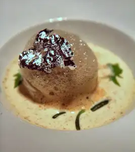 Purple potato (Italy-grown) cooked in clay, sea urchin egg sauce, sea beans (Buddhas fingers)