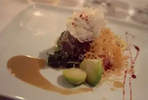 Hazelnut-crusted venison loin, horseradish potatoes, foie gras & chestnut sauce with G Sake Fifty