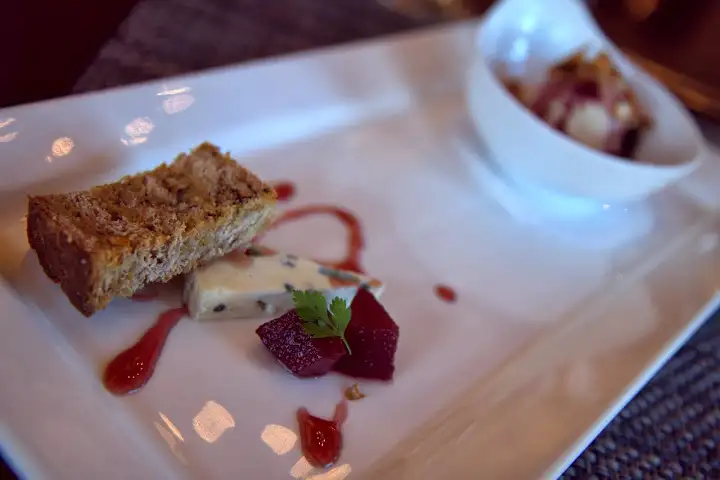 Chef's seasonal cheese selection (blue cheese) and peanut butter mousse, dark chocolate ganache, red wine soaked blueberries, pretzel crunch (streusel) with 2011 Port (Cabernet, Merlot, Alicante Bouschet) distilled at St. George/Hangar One