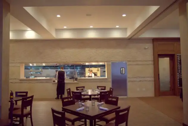 Amoura's spacious, clean dining room looks into the kitchen in the back