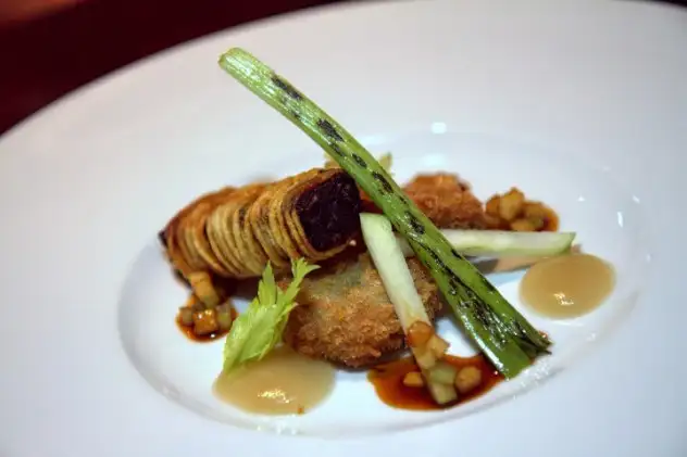  black pudding (blood sausage) wrapped in a pastry with pig’s trotter, ham hock and notes of apple and Madeir