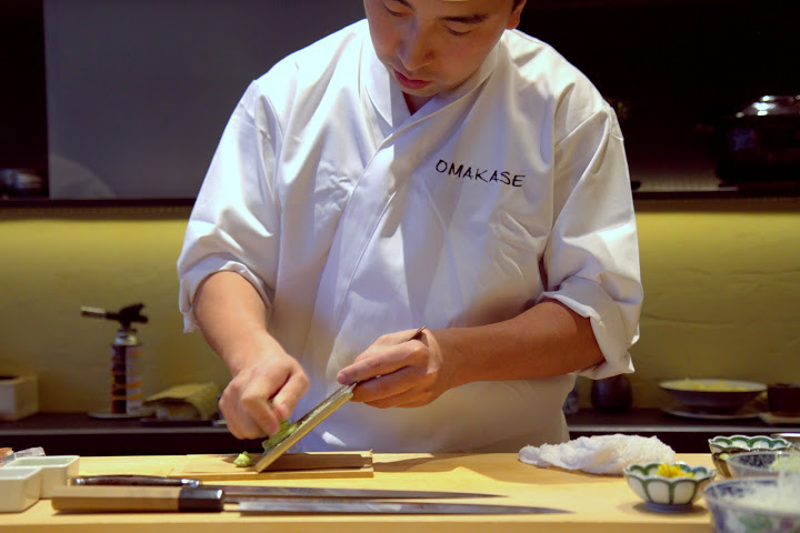 Chef Jackson Yu grating fresh wasabi at Omakase