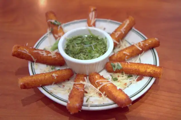 Rocco's crispy, tasty polenta sticks with garlicky pesto dipping sauce ($10)