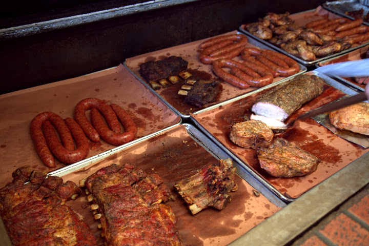 You choose your meats from the pit outside - conveniently, you can take a little slice of everything from sausages to brisket to ribs and try all