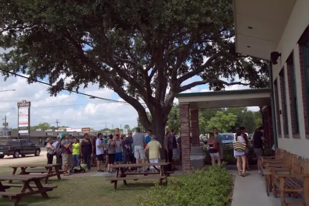 The line begins about an hour before opening