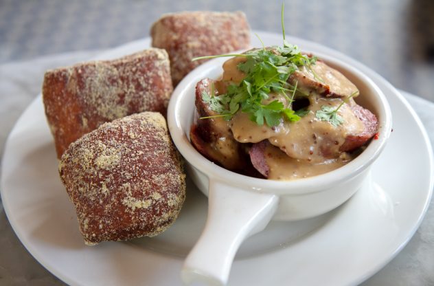 Comstock Saloon's beer sausage and beignets