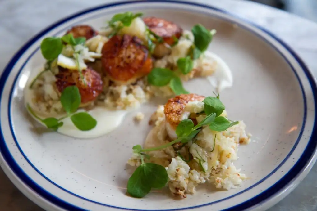 Comstock Saloon's day boat scallops ($22) and shredded cauliflower in lemon relish and galangal ginger sauce