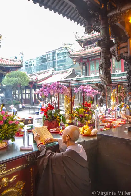 Praying monk at Lungshan Temple, Taipei